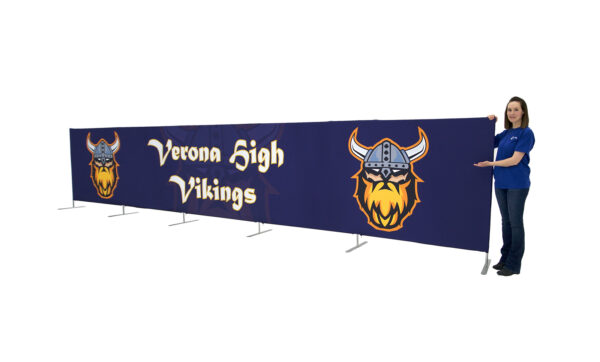 photo of woman standing next to twenty five foot long flow partition with viking head graphic and verona high vikings