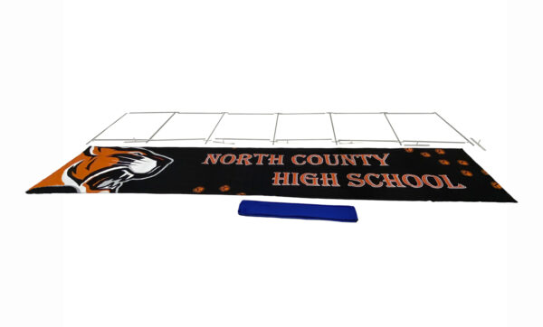 photo of thirty foot renovate partition that says north county high school with a graphic of a snarling tiger head fully broken down into its individual pieces