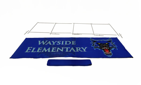 photo of twenty foot renovate partition that says wayside elementary with a graphic of a snarling wolf head fully broken down into its individual pieces